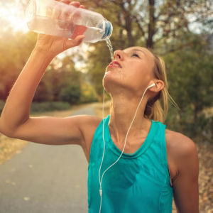 beautiful and sporty young woman drinking water royalty free image 1589560195 Tape2Tape